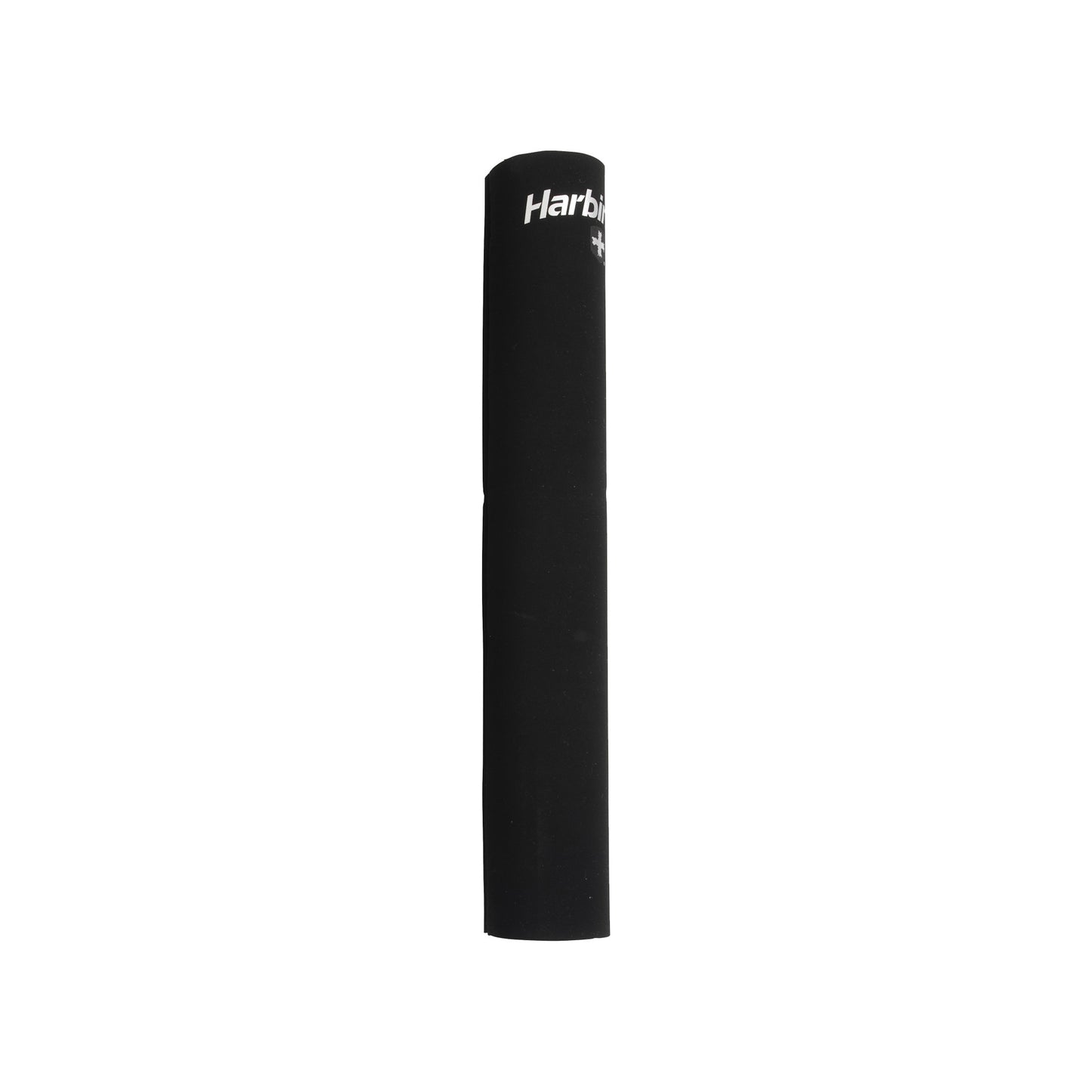 A black foam roller rests vertically in a plain white environment.