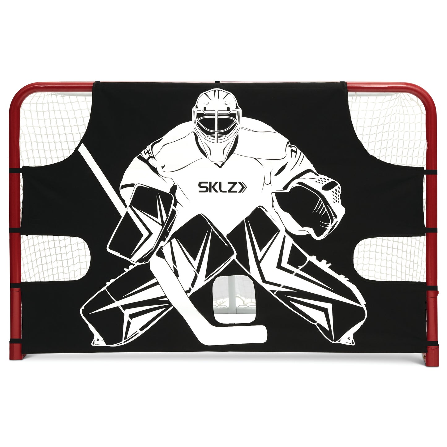 The goalie mask and pads block a goal in a hockey net on an ice rink