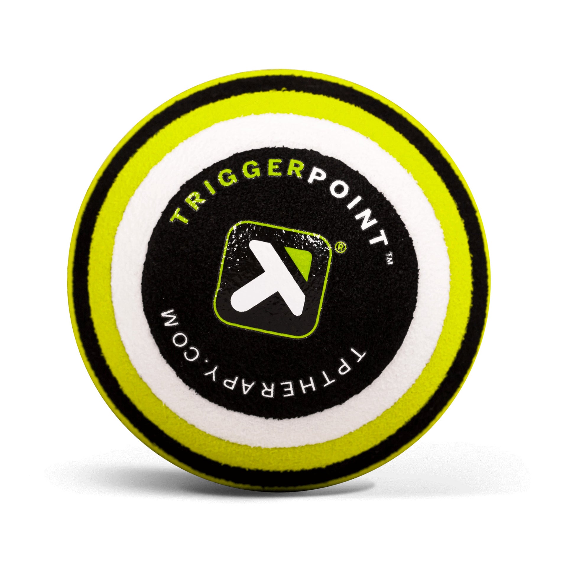A round foam puck displays the TriggerPoint logo and website, likely used for therapy or sports activities.