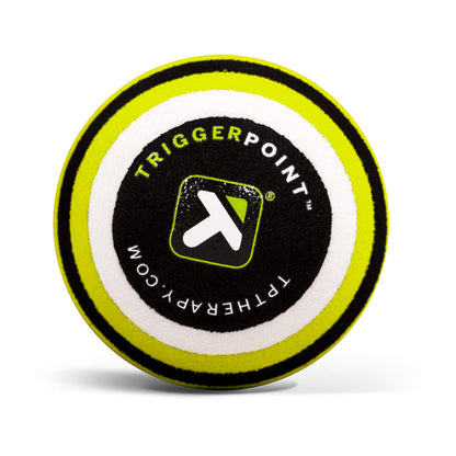 A round foam puck displays the TriggerPoint logo and website, likely used for therapy or sports activities.