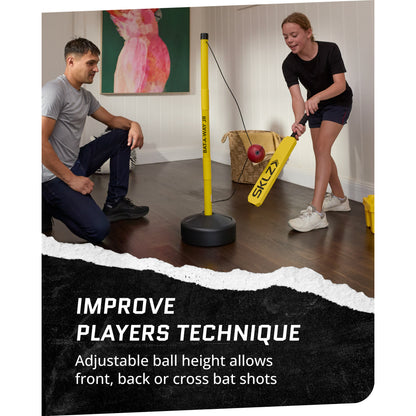 In use shot of female using SKLZ Cricket Bat-a-Way Jr. swing trainer inside with a male watching with text overlay text highlighting improving technique