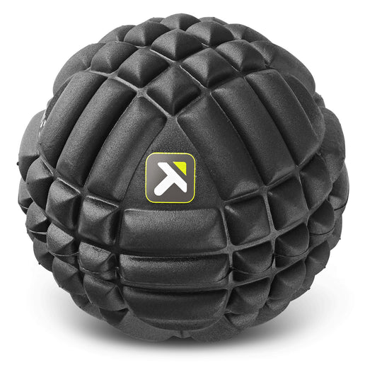 A textured black exercise ball with a logo on its surface in a plain white background