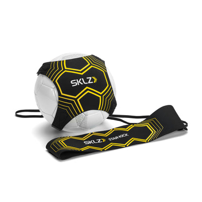A soccer ball with a black and yellow strap and face mask in a white background