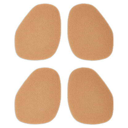 Four beige adhesive pads are arranged in a square on a white background.