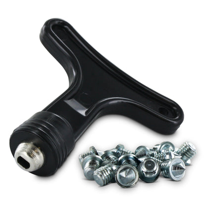 A T-handle wrench tightens screws around a tire wheel with bolts in a workshop environment.