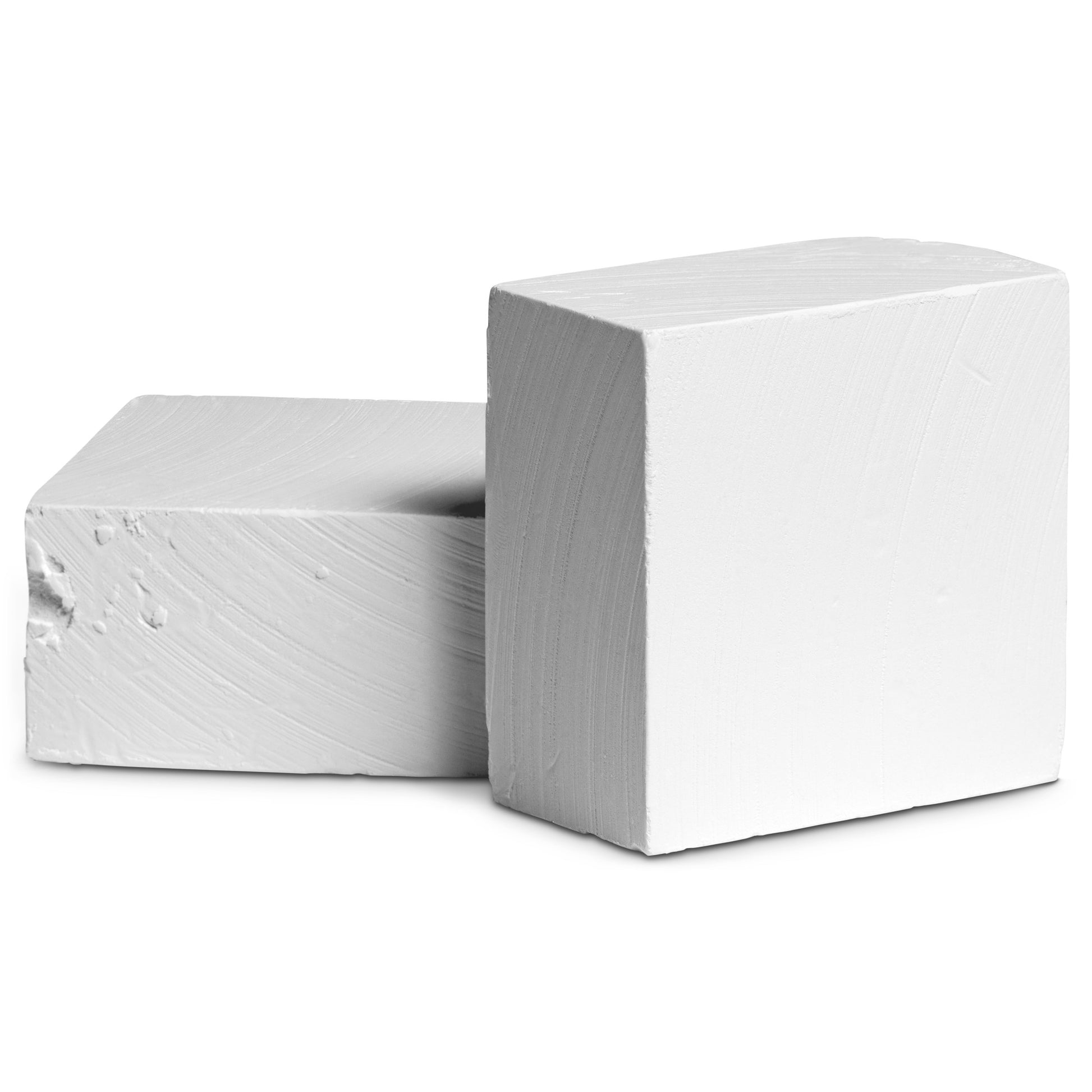 Two white rectangular blocks rest on a plain surface, each with a smooth texture.