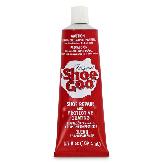 Tube of Shoe Goo repairing and protecting footwear on plain background