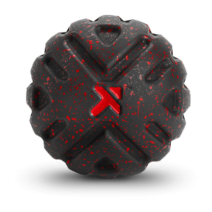 A black textured object with red paint speckles and a red X symbol in the center.