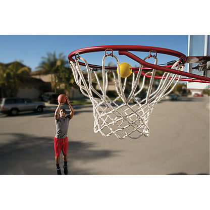 Shot of a male shooting a jump shot with the SKLZ Basketball shooting target on the rim in the street