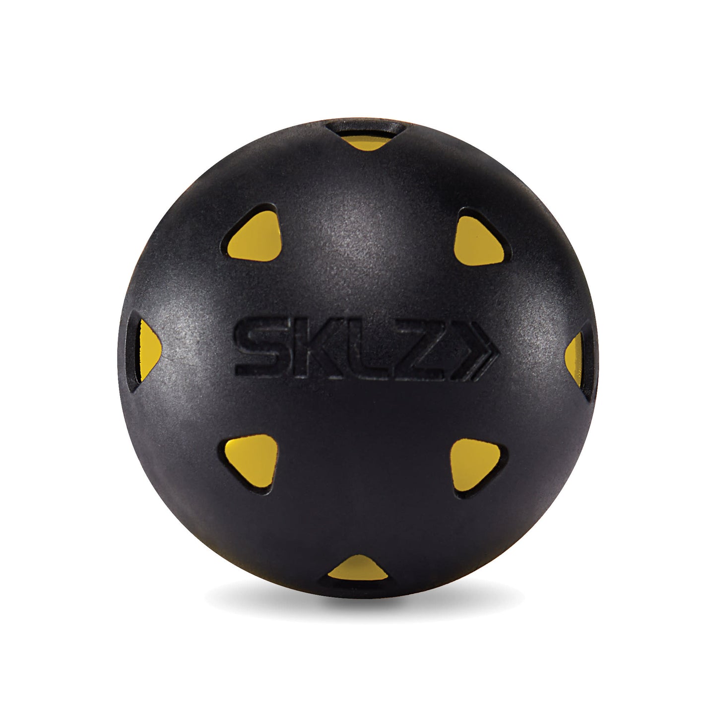 A black medicine ball with yellow accents rests on a white background
