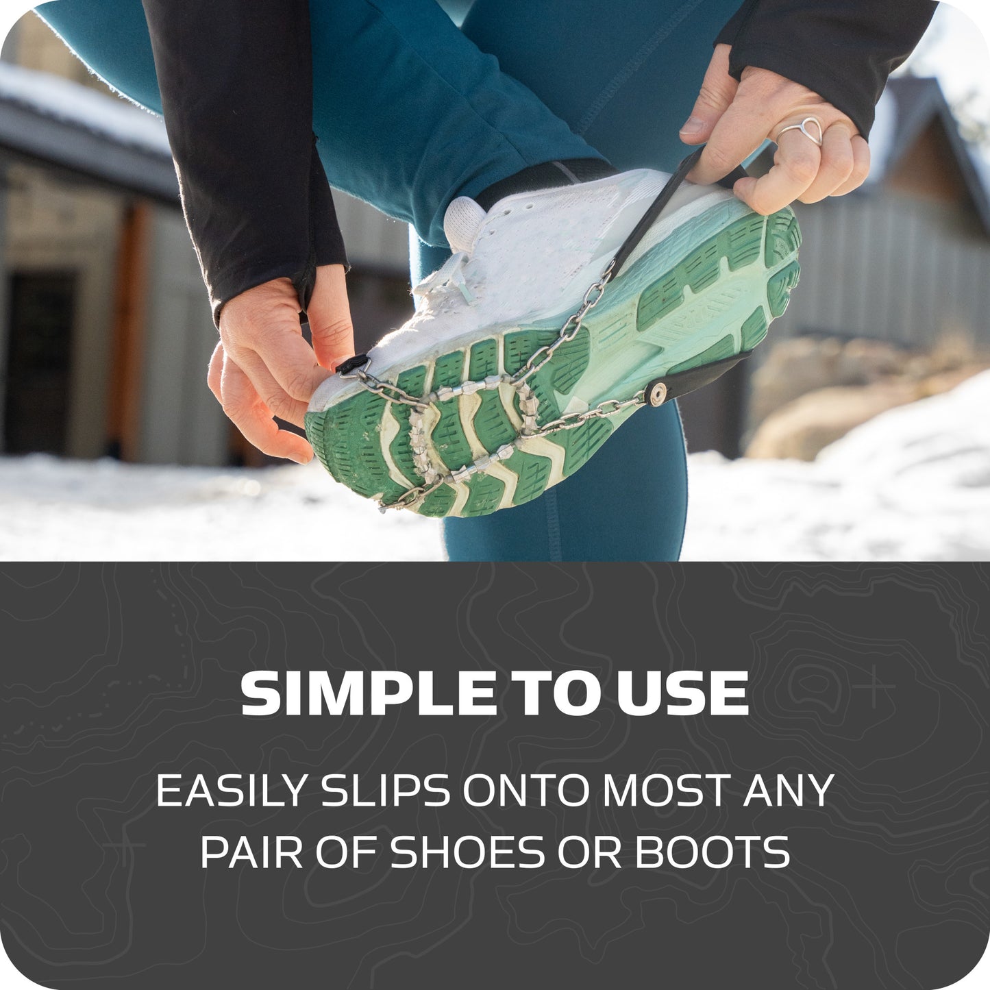Person secures snowshoe with crampon strap outdoors in winter environment