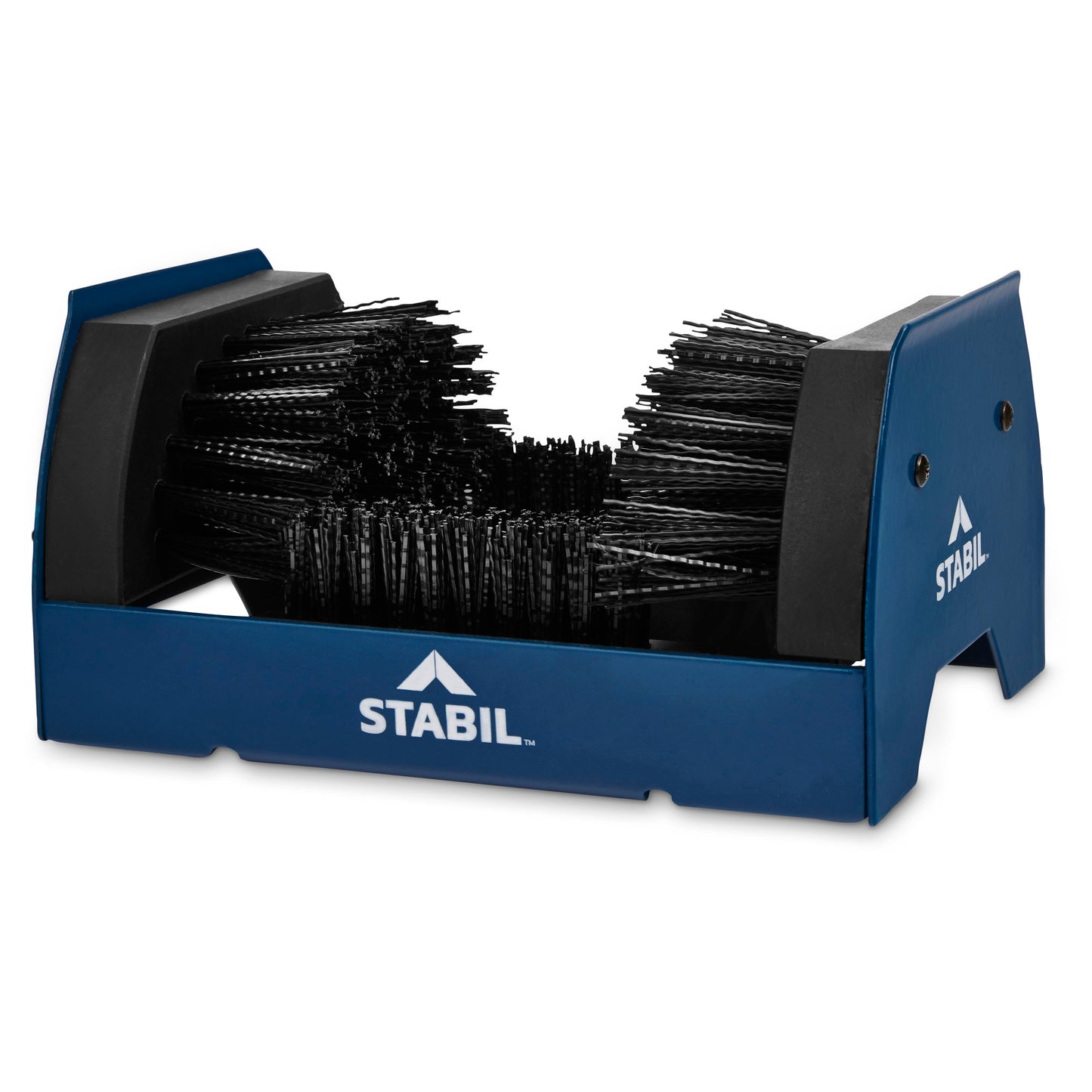 The brush holder displays a collection of black brushes in a blue container used for organizing desk tools