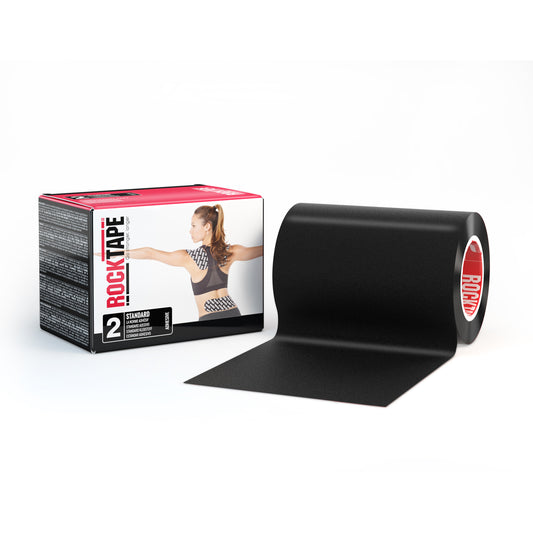 The black kinesiology tape unrolls from a roll beside its packaging box on a white background.
