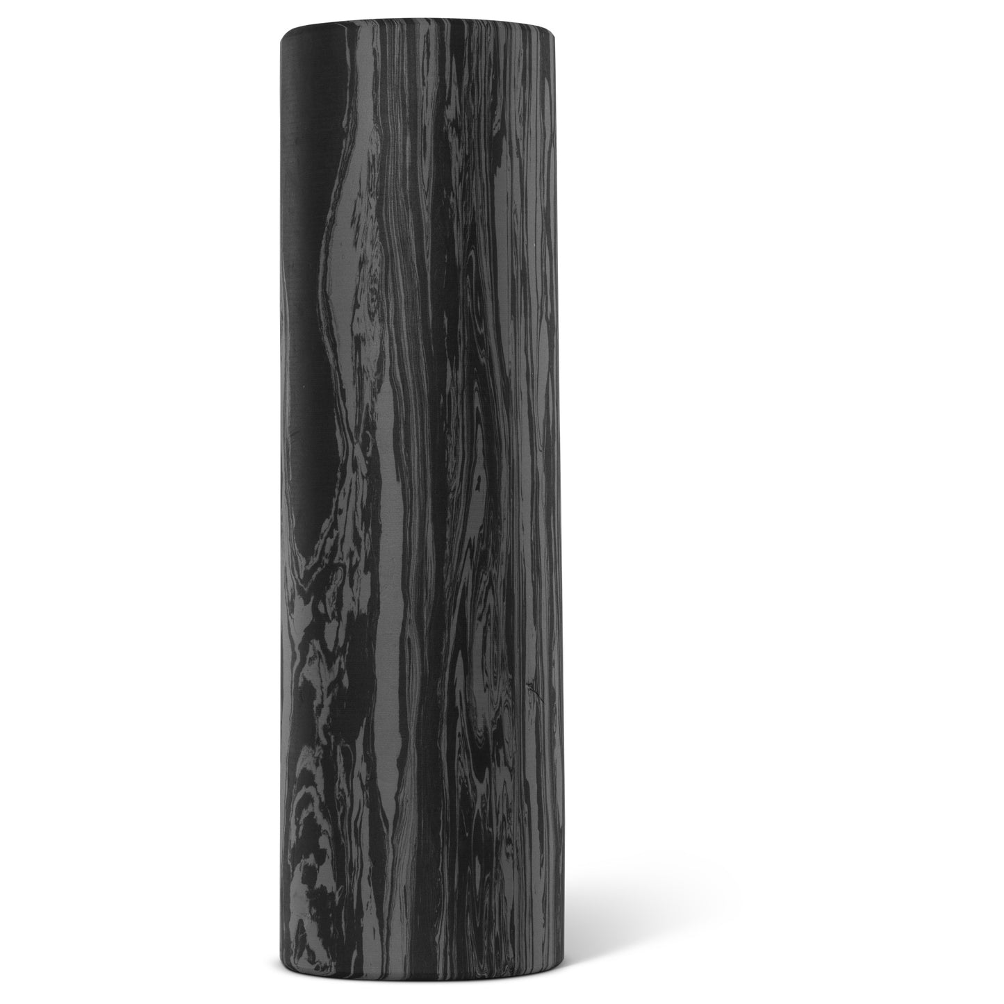 A black marble cylindrical object stands upright in a white space.
