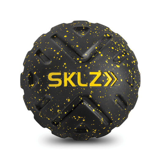 A black and yellow speckled rubber ball with the text SKLZ and directional arrows on it