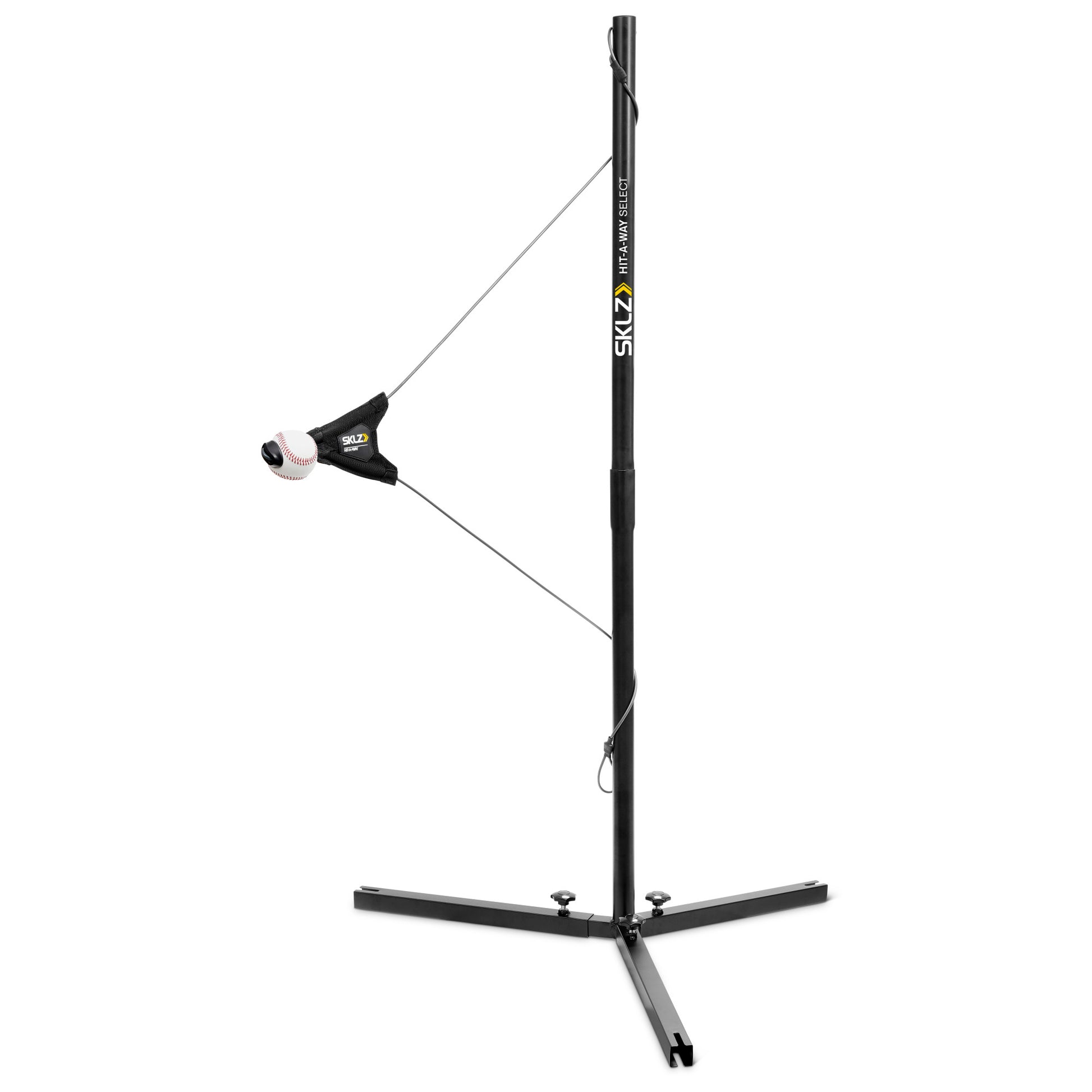 A golf swing trainer extends on a stand for practice in an indoor or outdoor space