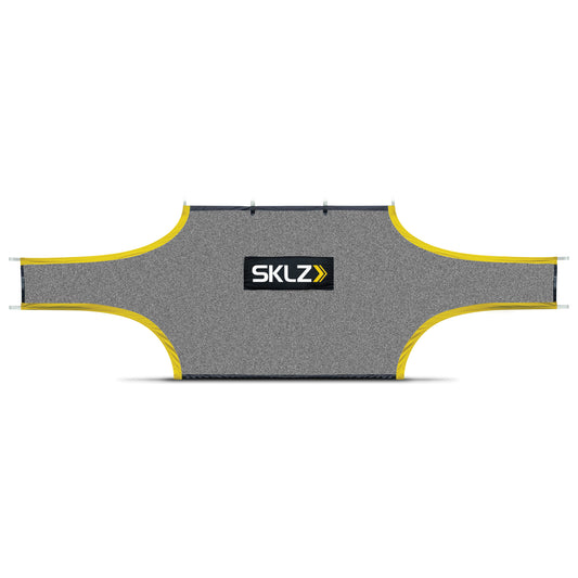 The inflatable ski jump is set up outdoors on a snowless surface for recreational use