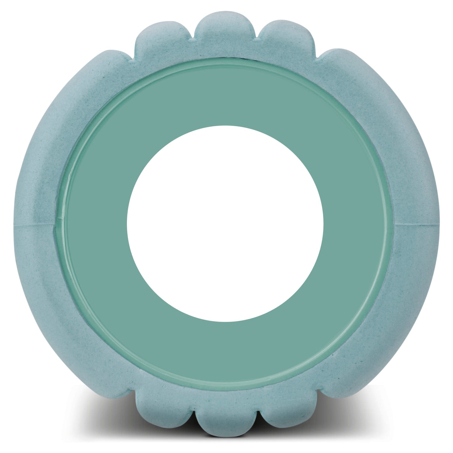 A circular inflatable pool is floating outdoors on water in a scenic natural environment.