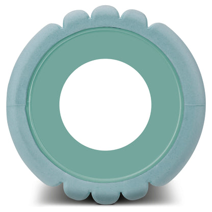 A circular inflatable pool is floating outdoors on water in a scenic natural environment.