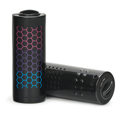 Black cylindrical pods with colorful hexagonal pattern resting on a white surface.