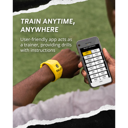 A person uses a smartphone app for workout drills while wearing a yellow fitness wristband.
