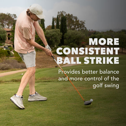 Golfer swings club on course to improve balance and control of golf swing.