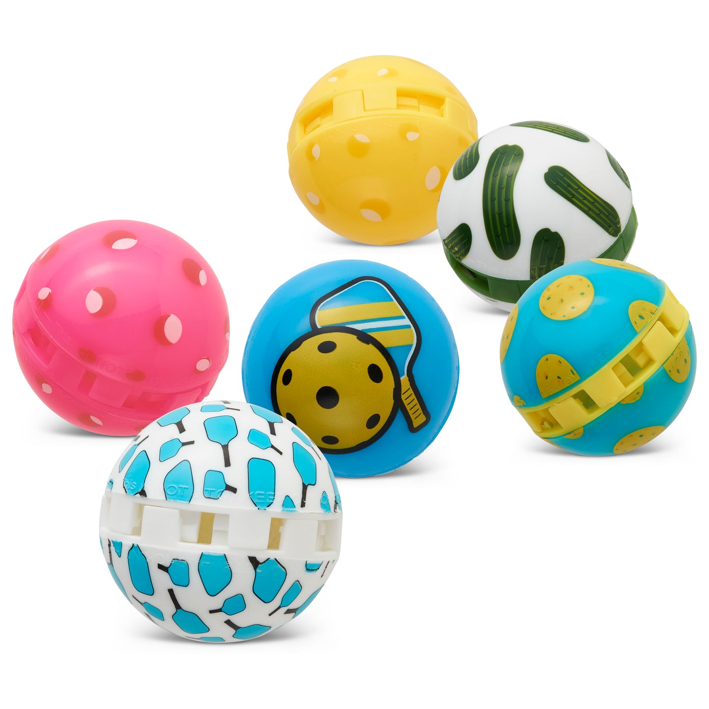 Six colorful plastic balls with various patterns and designs are scattered on a white surface.