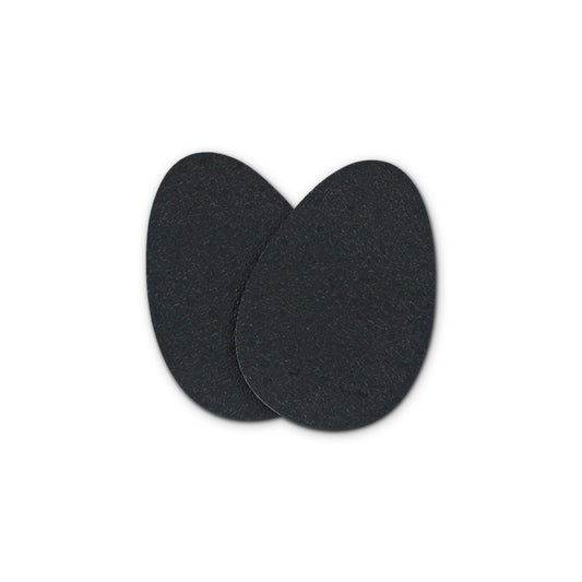 Two black adhesive pads stick together on a white background, likely for cushioning or grip.