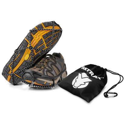 The snowshoe and boot are displayed with a carrying bag and clip on a white background.