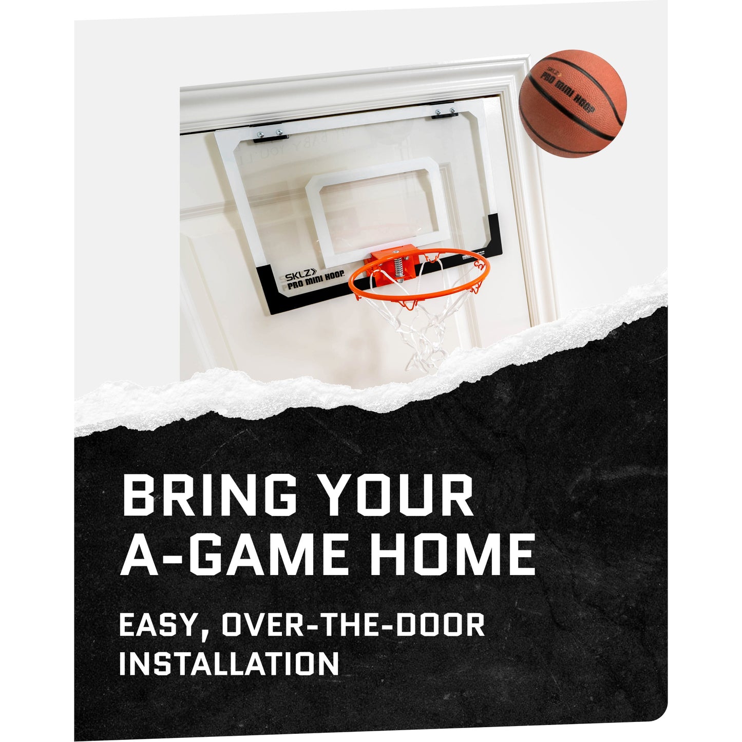 Basketball hoop attached to door frame in indoor room with ball nearby for quick installation