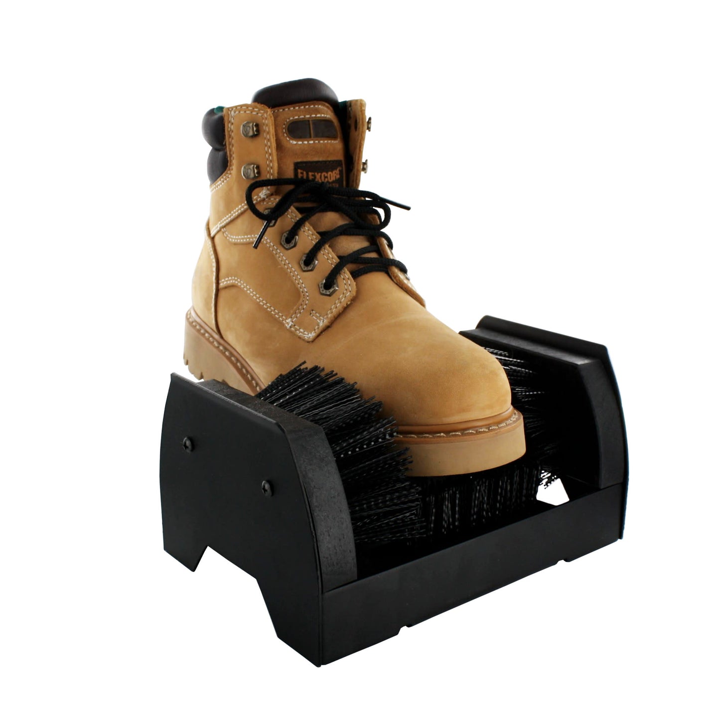 A tan work boot is cleaned by a boot brush on a black shoe cleaning device