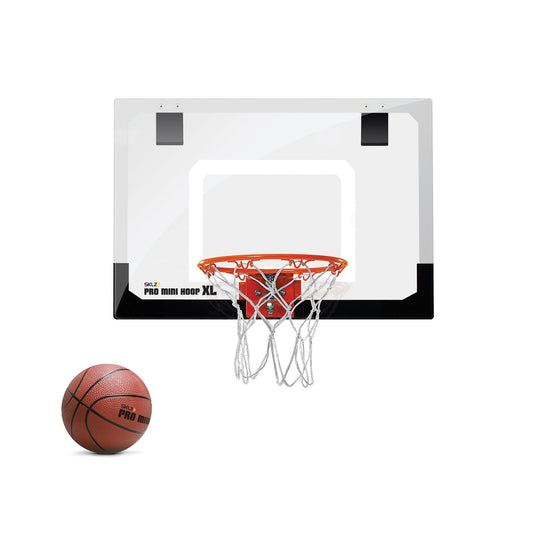 A basketball is near a hoop on a white background