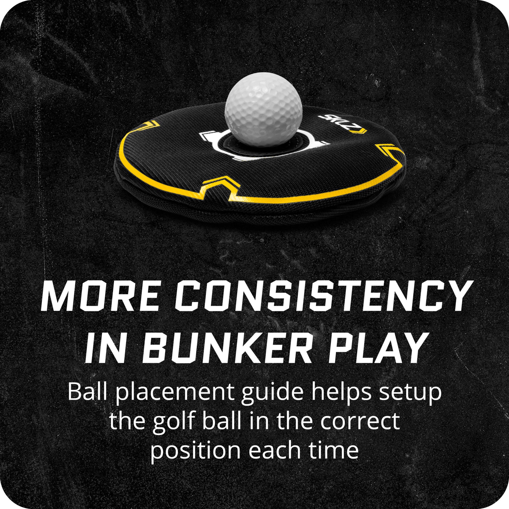 A golf ball on a placement guide for positioning during bunker shots in a practice area