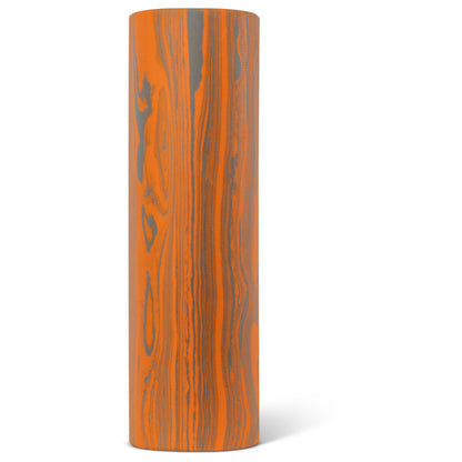 A tall wooden cylinder with orange and gray marbled pattern on a white background.