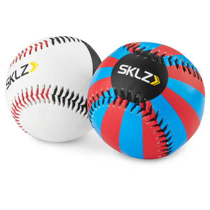 A baseball and a medicine ball are placed on a white background for training or exercise.