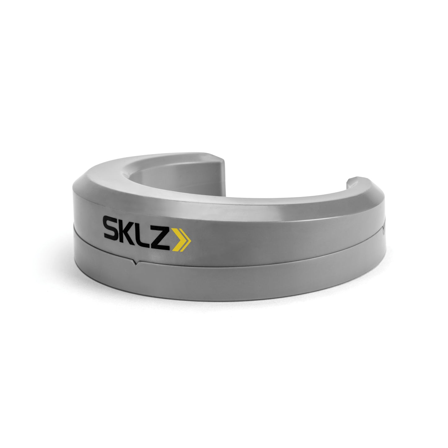 A curved plastic barrier with SKLZ branding in a plain white background