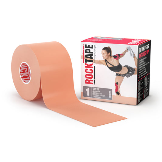 The kinesiology tape is unrolled beside the box featuring a woman stretching in a gym.