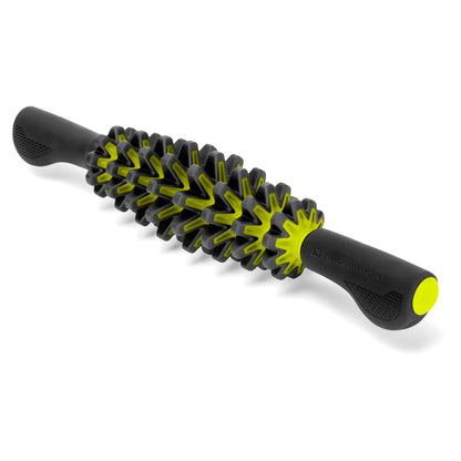A flexible massage roller with a textured surface lies on a plain background.