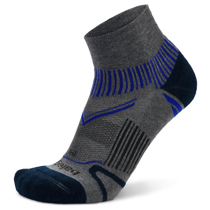 A technical sock is displayed with patterns and padding for athletic footwear