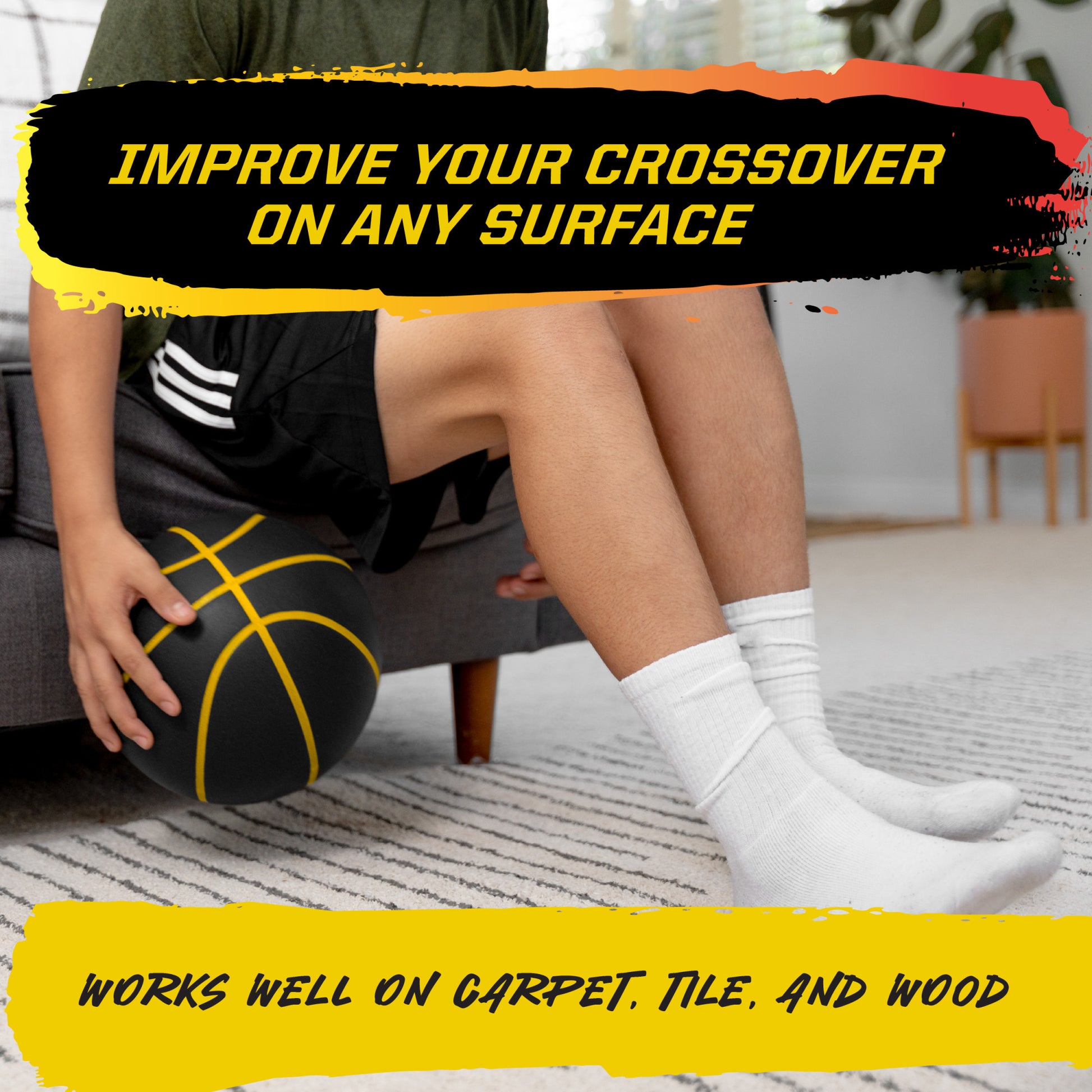 Ball rests by seated persons legs on a carpet in a living room.