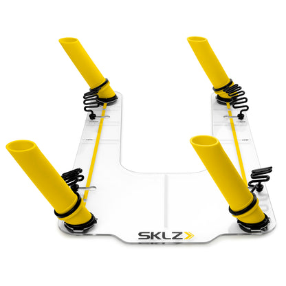 Four yellow and black skitz shock absorbers are mounted on a clear base in a testing setup