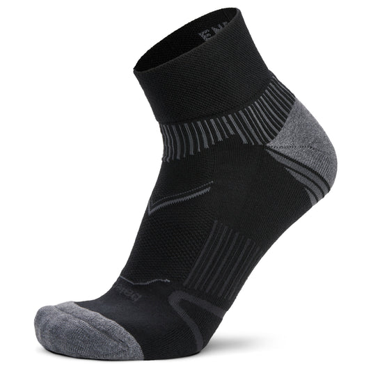 A sports sock supports the ankle in a running shoe on a white background.