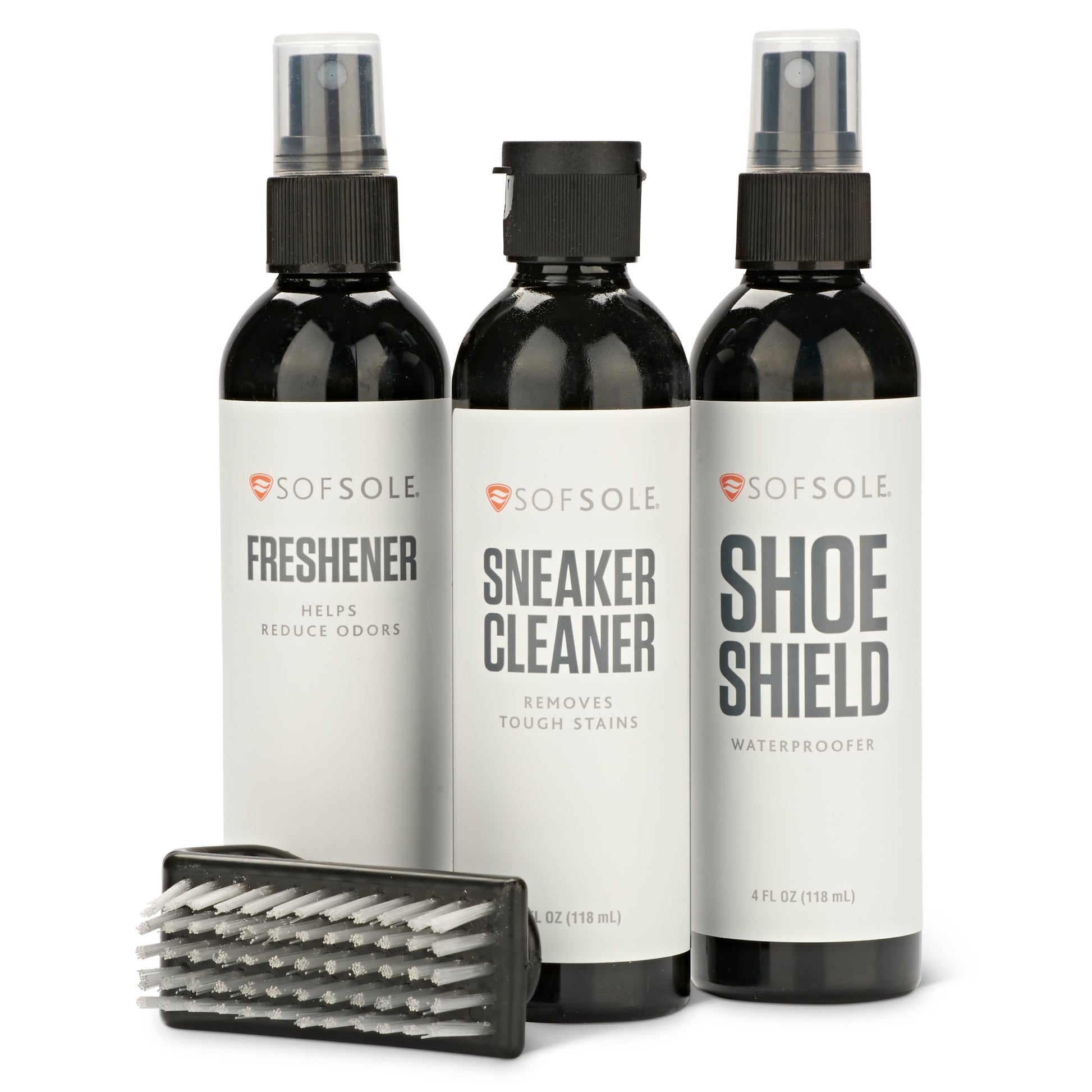 Three spray bottles and a cleaning brush for shoe maintenance on a white background