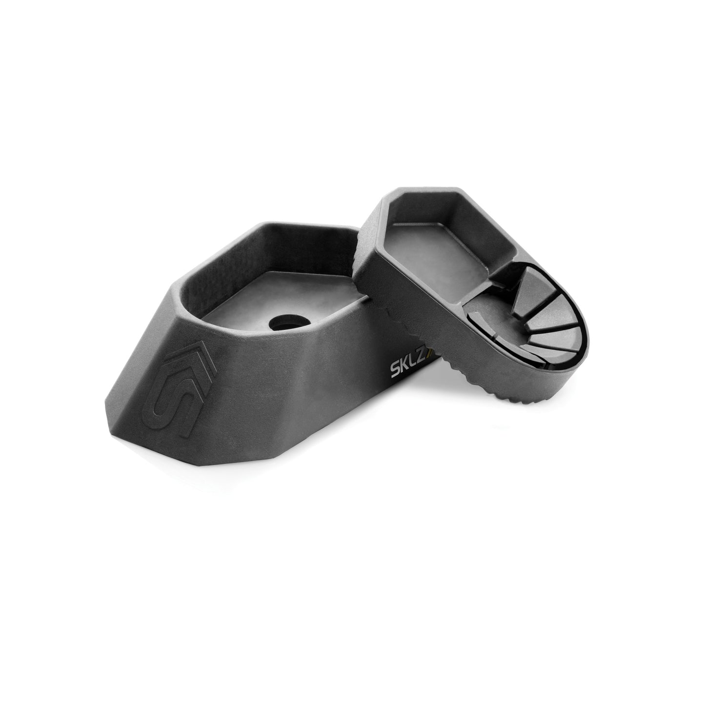 A black skate tool holder with a removable tray on a white background