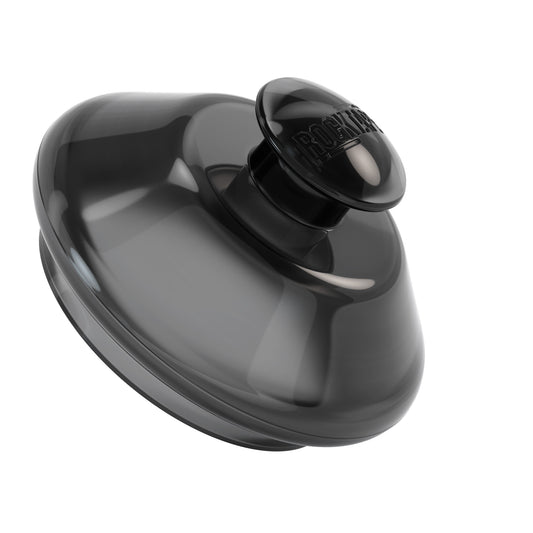 Shaker bottle agitates supplement in a cup against a plain background