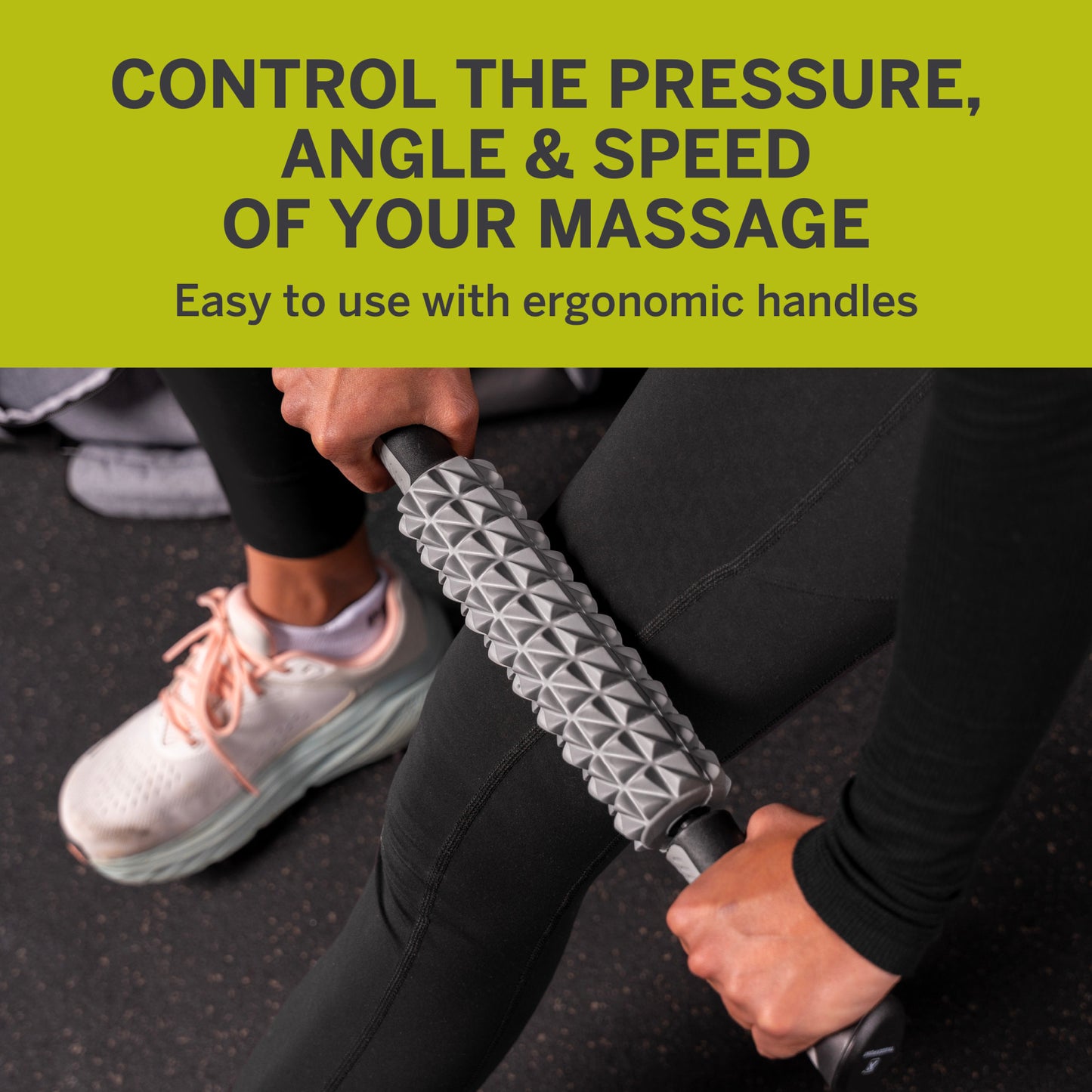 Hands use massage roller on leg, wearing workout clothes, gym setting.