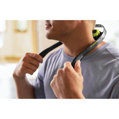 Man adjusts neckband headphone in a room during workout or daily activity session