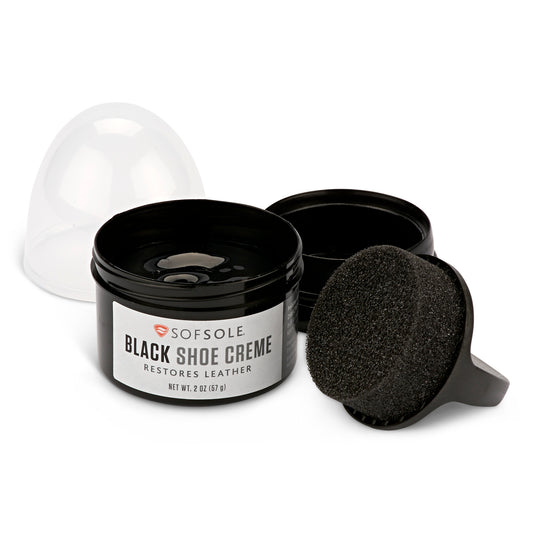 A shoe care kit with lotion, sponge, and cover on a white background.