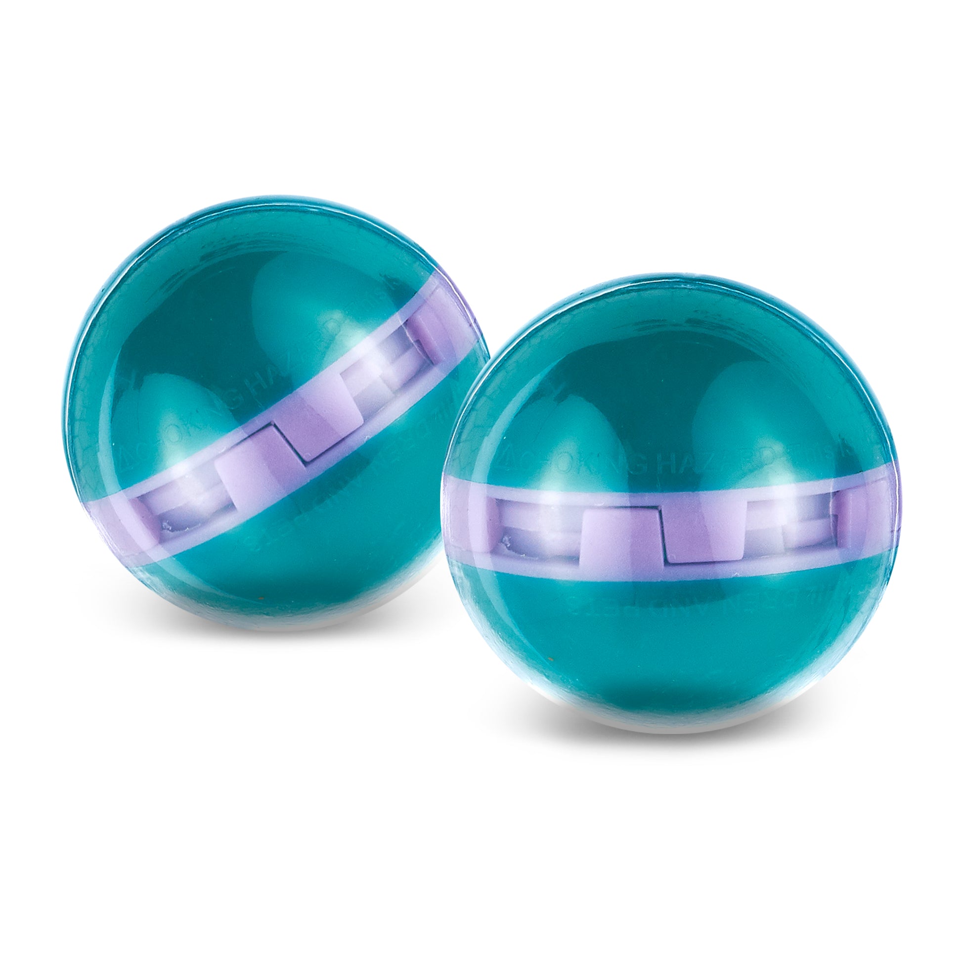 Two marbles roll on a white surface in a plain environment.