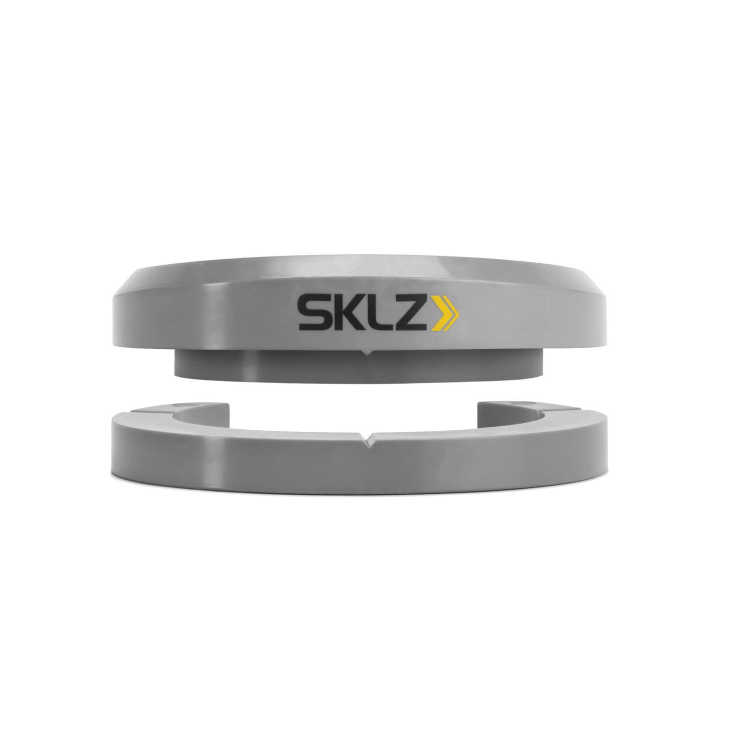 A metallic SKLZ training aid assembles around a ball in a controlled environment
